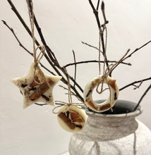 Load image into Gallery viewer, Scented with Christmas Spice - A stunning, spicy Christmas composition. Warming notes of nutmeg, cinnamon and clove underpin a glazed orange heart. A must-have Christmas classic!
Set of 3 - includes one circle, one star and one ring
All wax melts are individually hand made and decorated making them all unique so each will vary from the ones photographed. Decorated with cloves, cinnamon and orange.
All created using a natural soy wax blend.
Perfect to be used as a hanging decoration, room freshener a